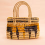 Bolsas_Indigenas_006_1_c0c16f03-48e9-49c4-bf35-319bcfd516ef_bolsas+tramas-e-cores–indigena-comprar-banner-site-tucum
