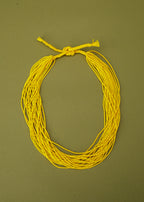 Colares_Indigenas_041_60c085a5-aebb-45d0-ab3e-8ba4f633d7bf_colares-kamayura-indigena-comprar-banner-site-tucum